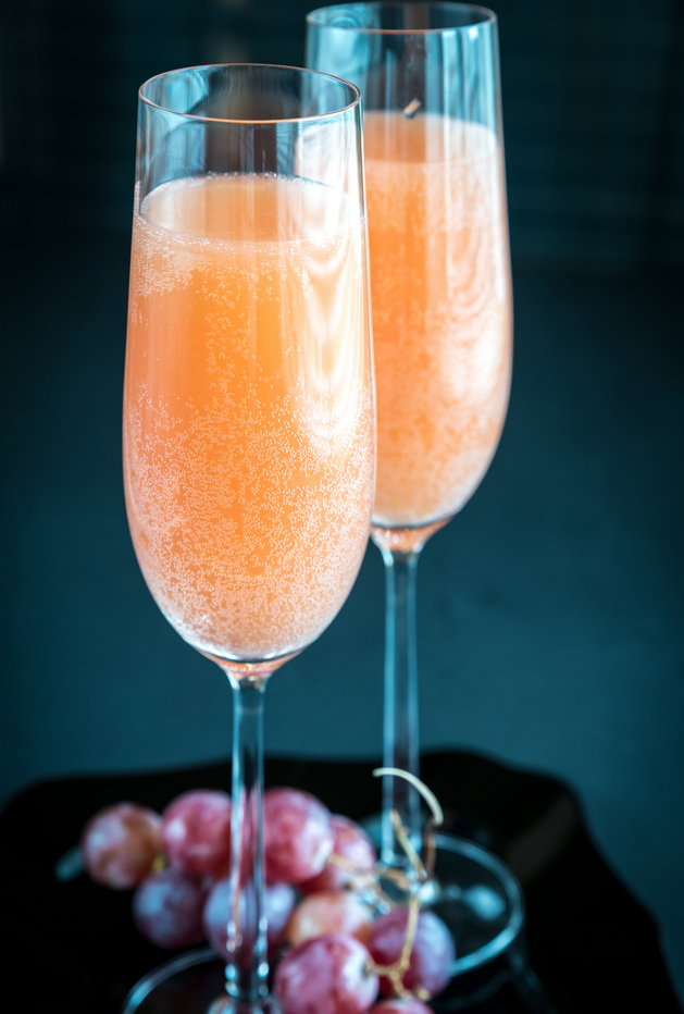 Peach bellini in a champagne flute